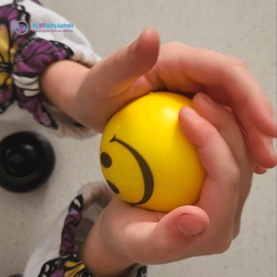 Playing with Squishing Smiley de stress ball
