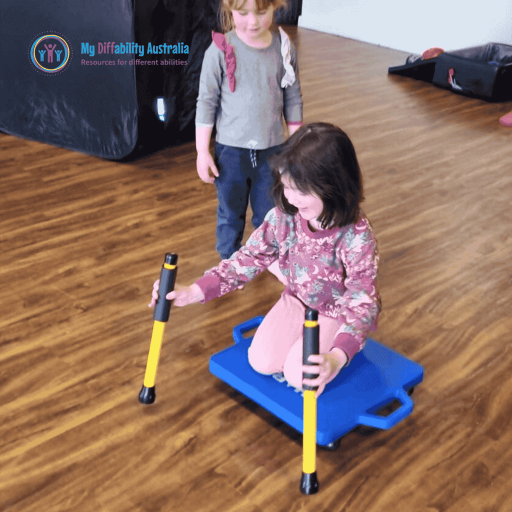2 Scooter Board Yellow Being Held by a young girl