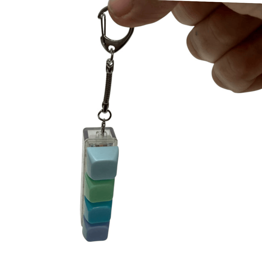 A hand holding Hang Sell Keyboard Click Fidget on Metal Keychain