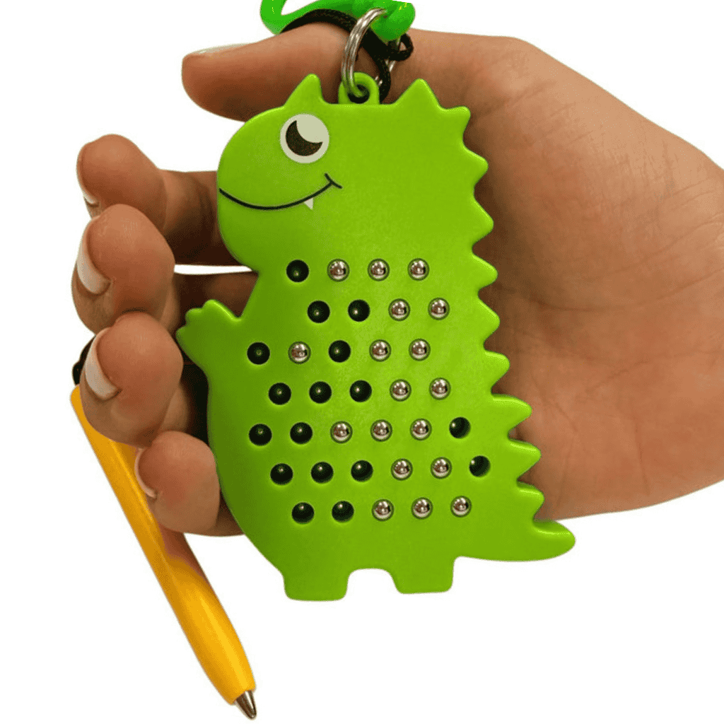 Dinosaur Magnetic Pad Keyring In a hand