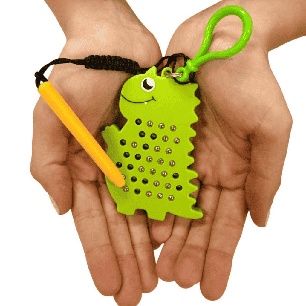 Dinosaur Magnetic Pad Keyring in hands