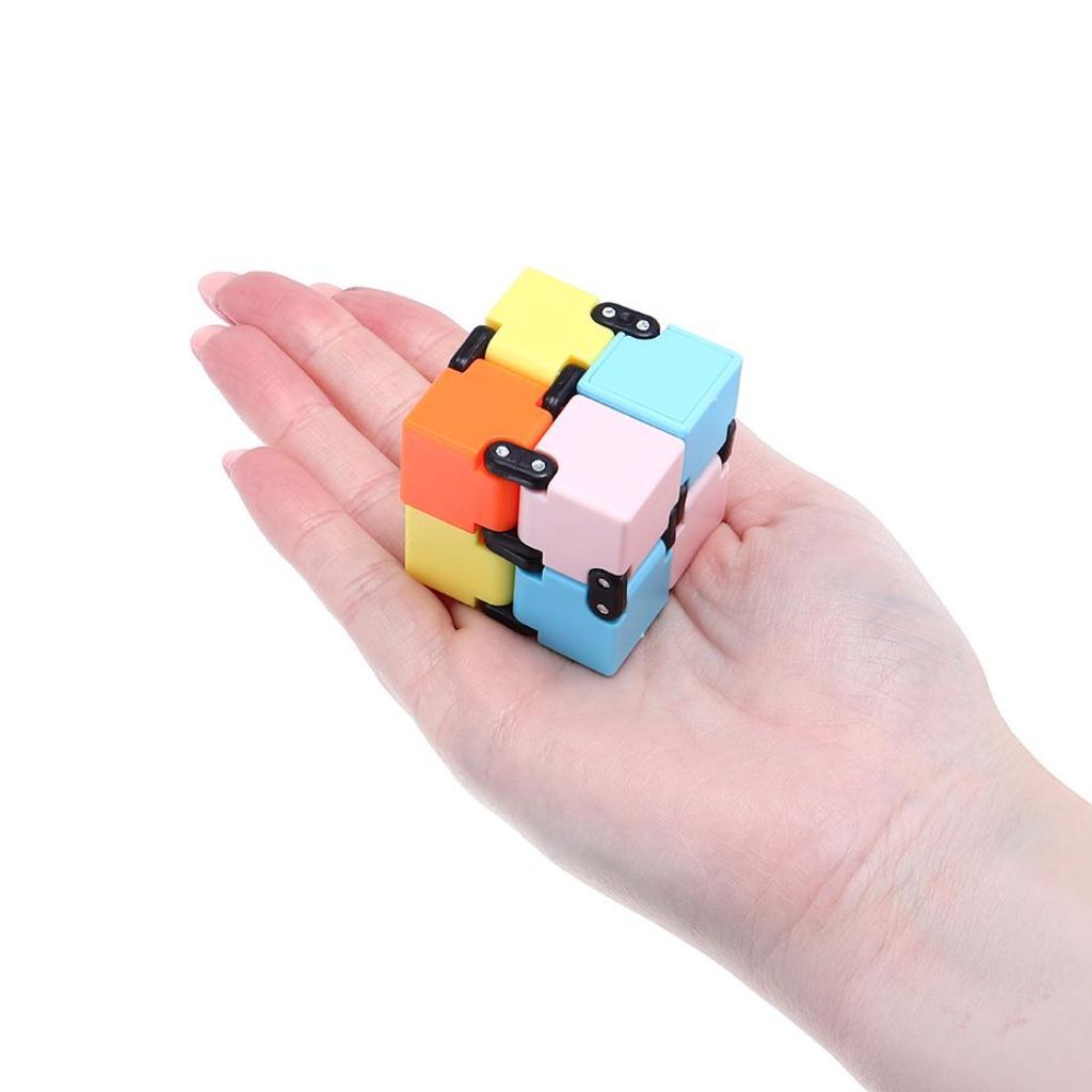 Fidget Infinity Cube placed in a palm