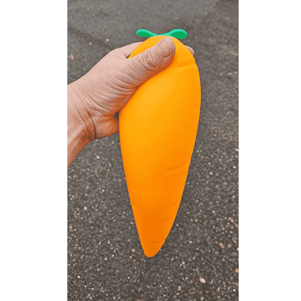 Hand Holding Giant Squeeze Mega Mellow Carrot Squish