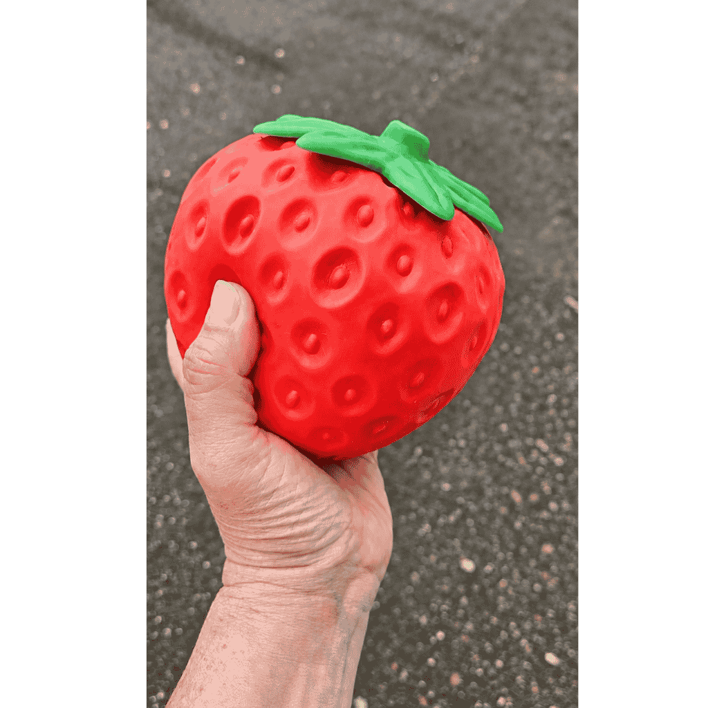 Hand Holding Giant Strawberry