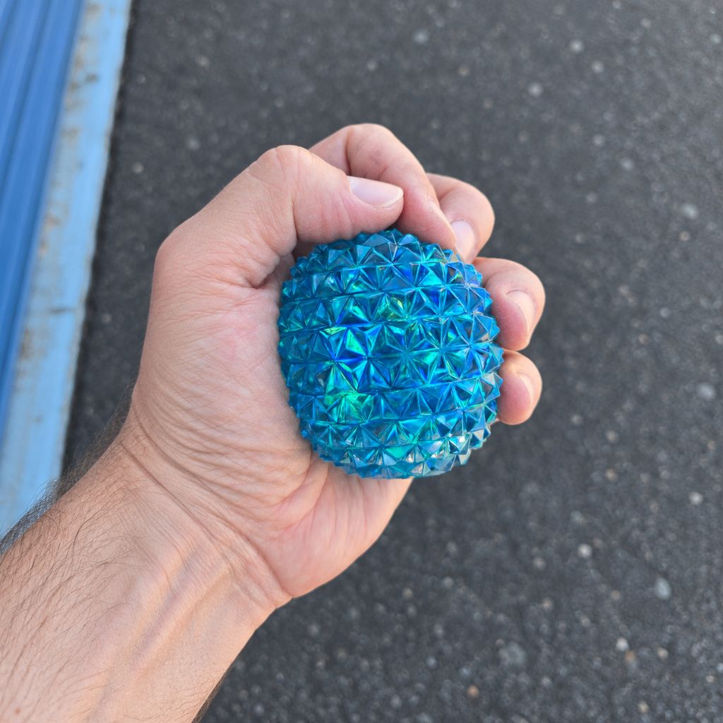 Hand Holding Squishing Blue Squeeze Sugar Diamond Stress Ball