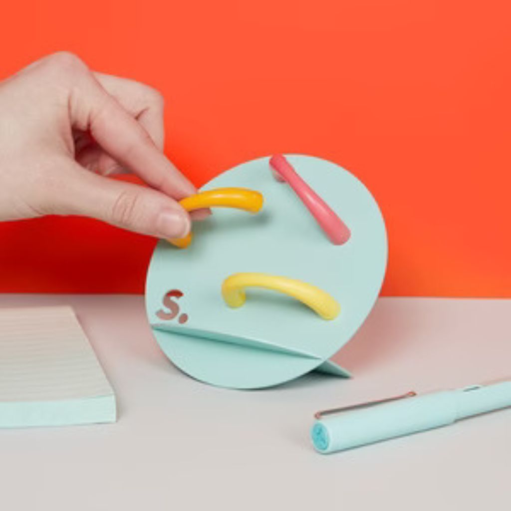 Hand Sticking Magnetic item to the Speks Desk Stand Mint Green