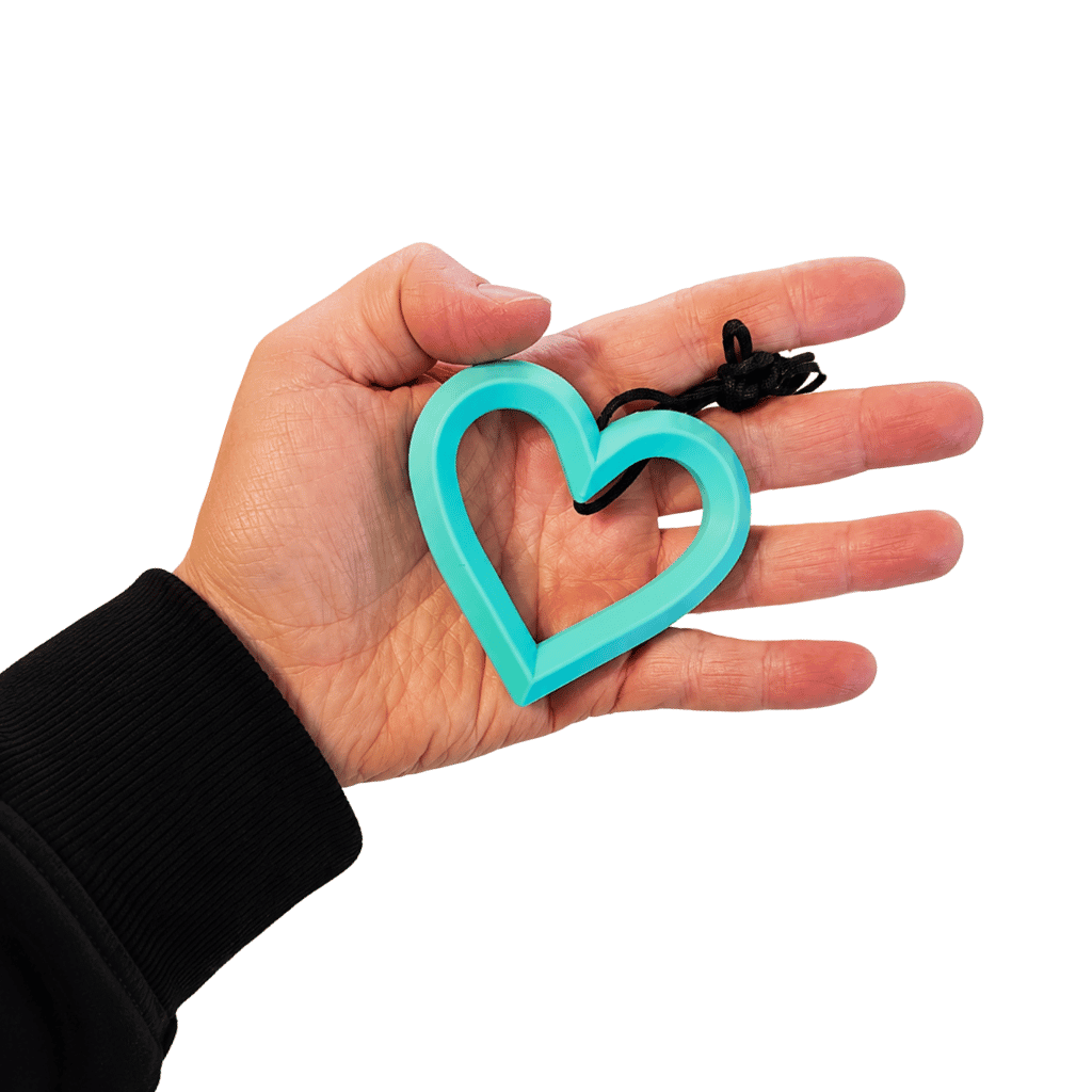 Heart Shaped Chewable Pendant Placed in a hands palm