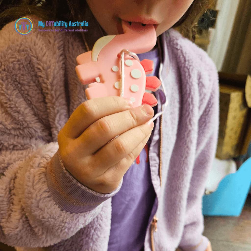 Kid Biting Pink Dinosaur Chewy Pendant