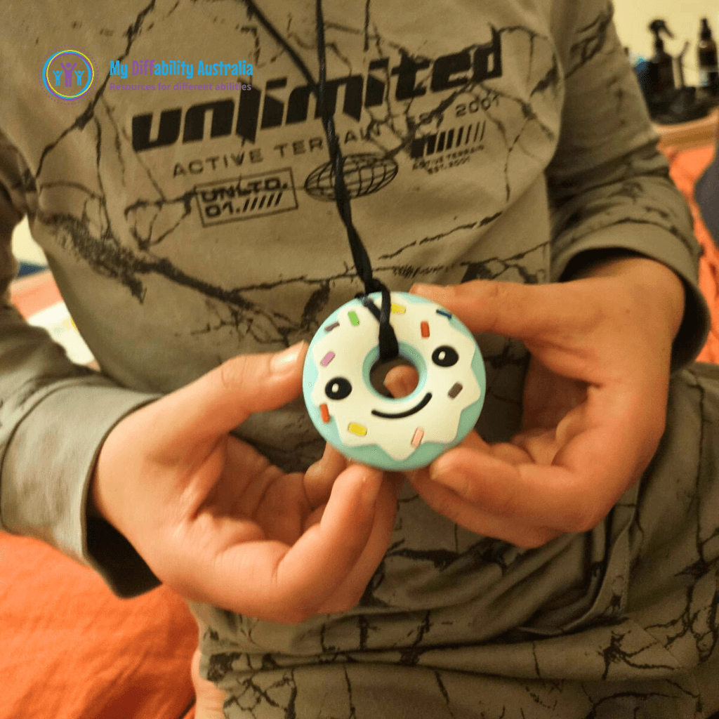 Kid Holding Chewy Donut Pendant