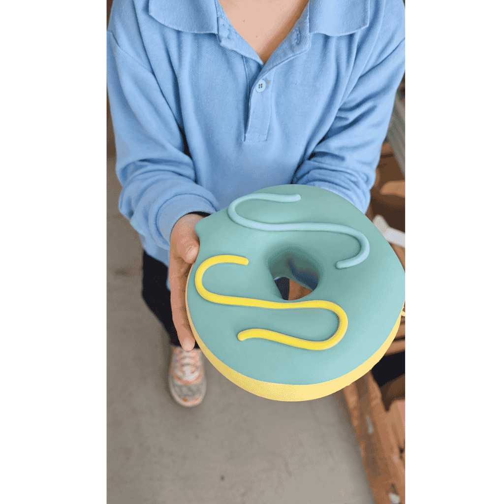 Kid Holding Giant Donut Squishy
