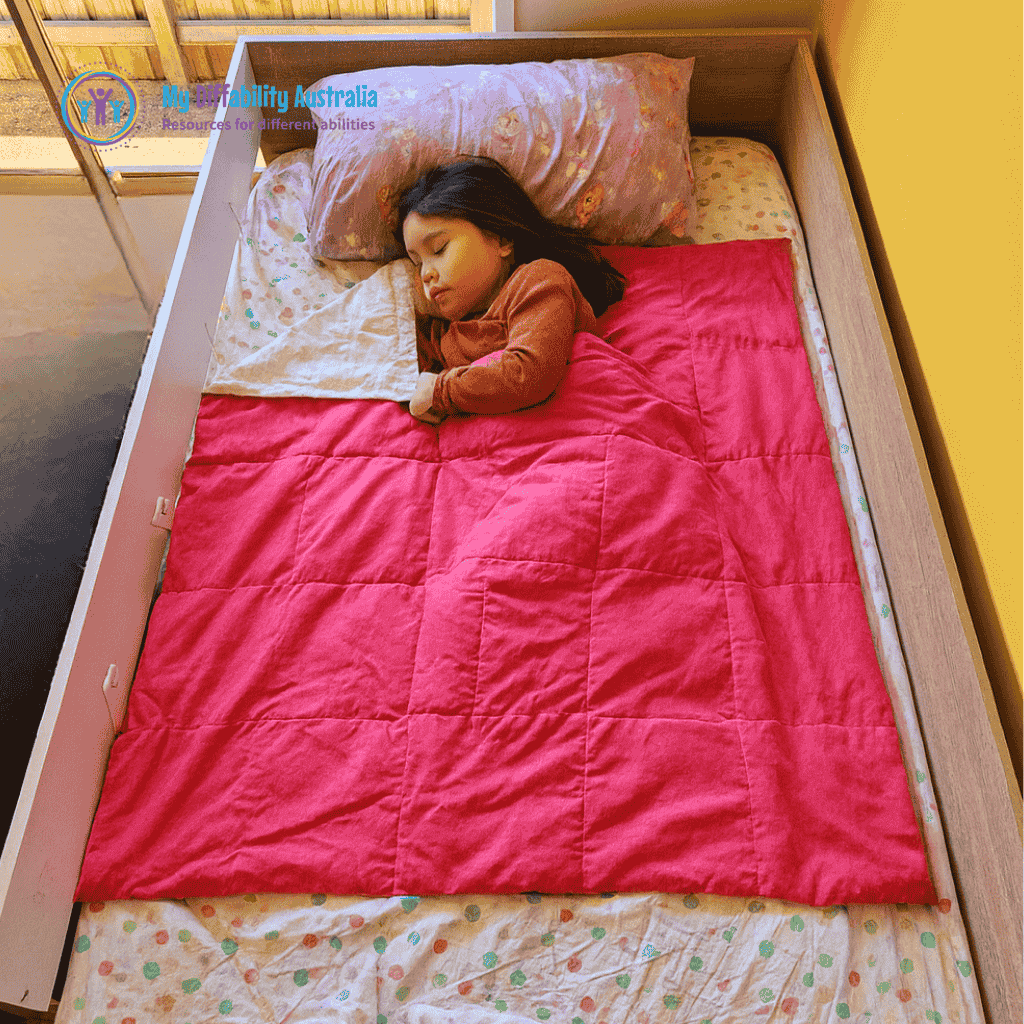 Kid Sleeping in Bed with Small Weighted Blanket Pink