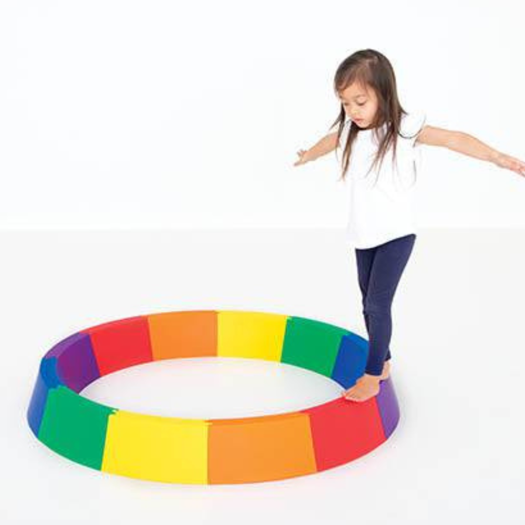 Kid Trying Round Balance Beams