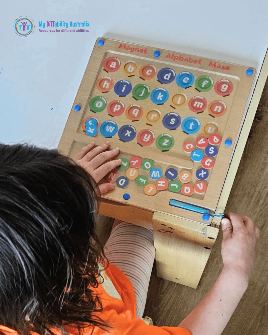Kid Using Magnetic Alphabet Maze Game