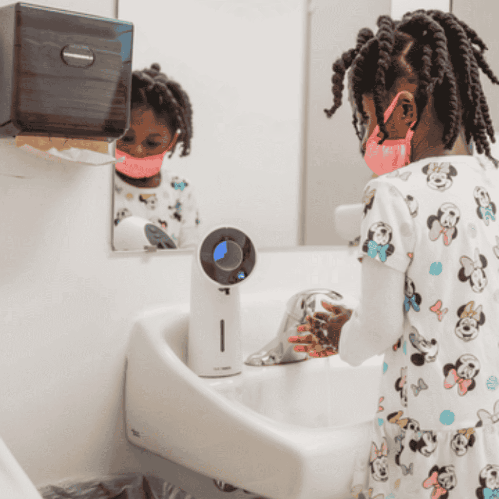 Kid Washing Hands In the Bathroom Sink with Time Timer Wash Plus Soap Dispenser