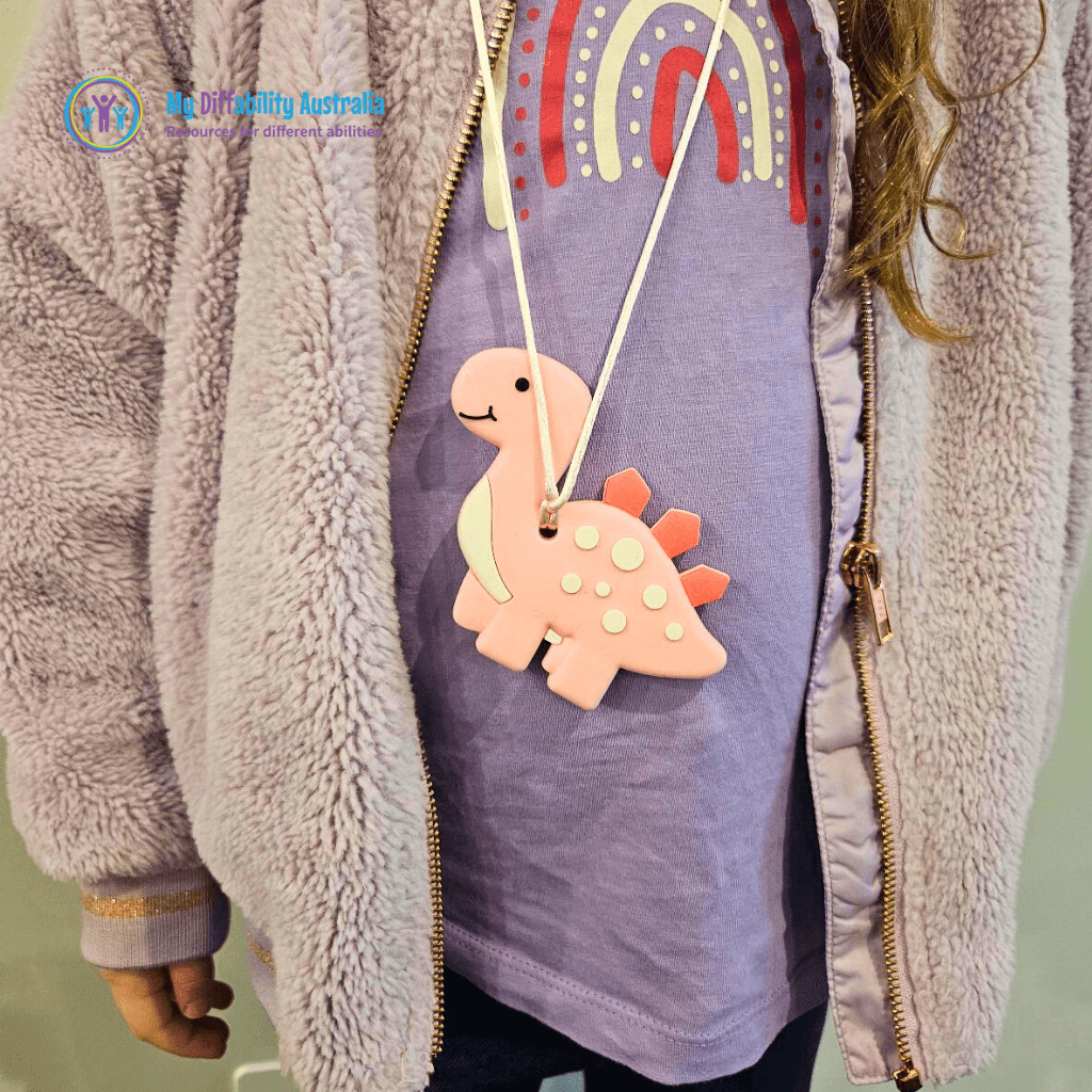 Kid Wearing Dinosaur Chewy Pendant Zoom Out