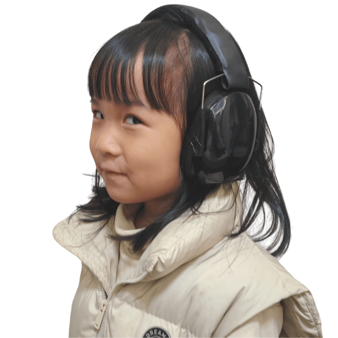 kid wearing ear defender black in side view