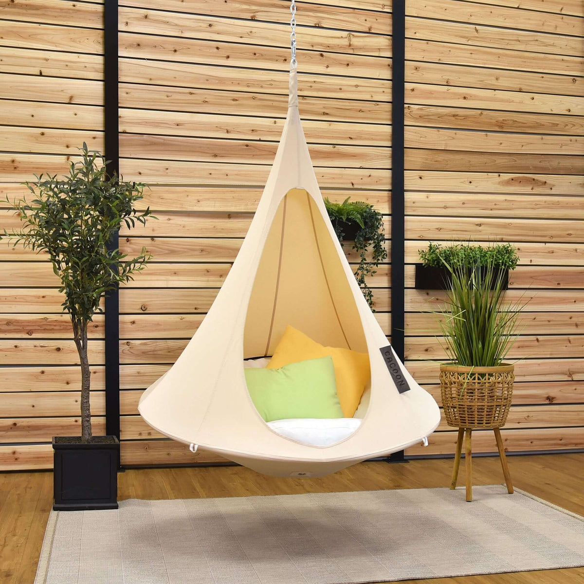 Kids Cacoon Natural White With some pillows on it