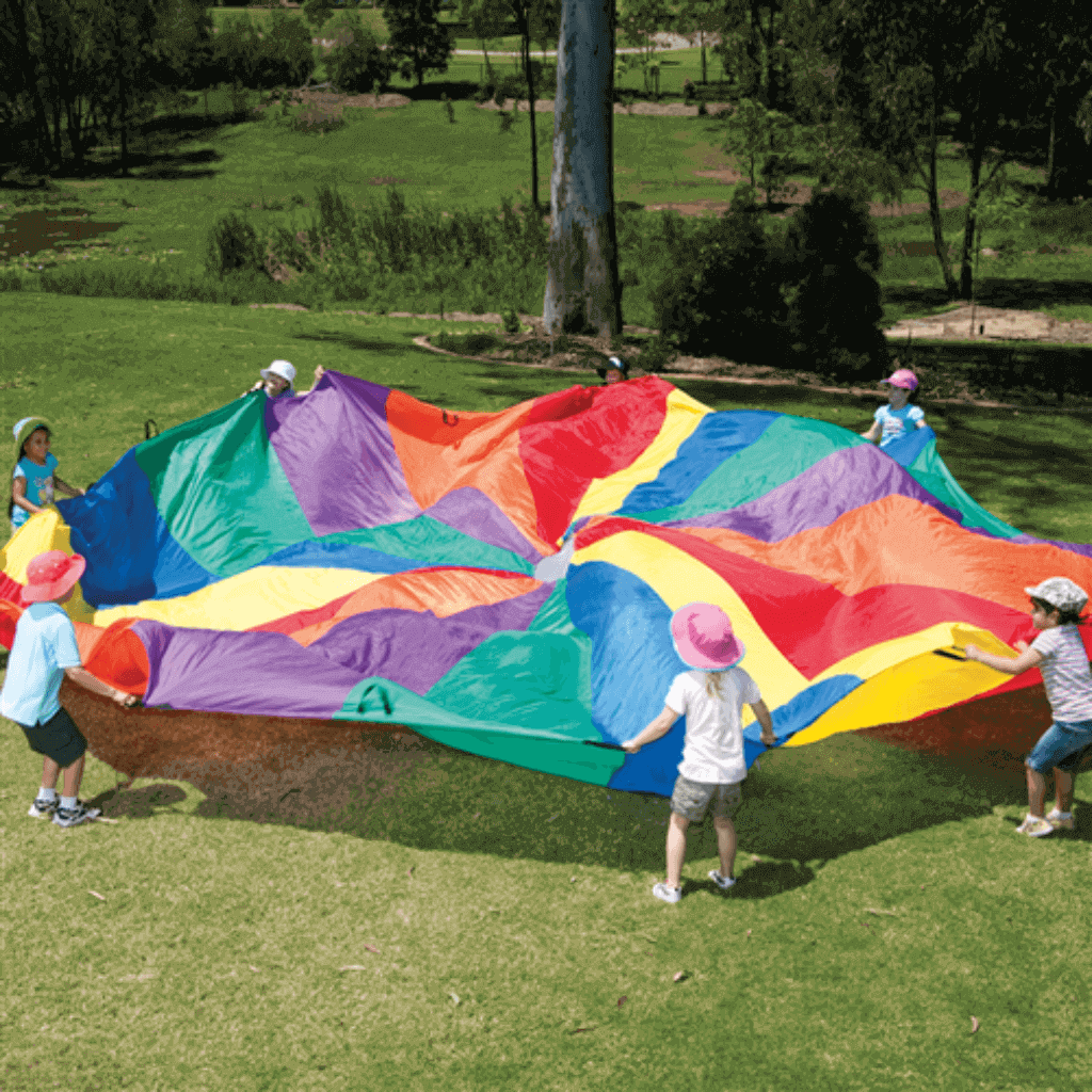 Kids Setting Up the Rainbow Parachute 4m diameter In An Outdoor Area