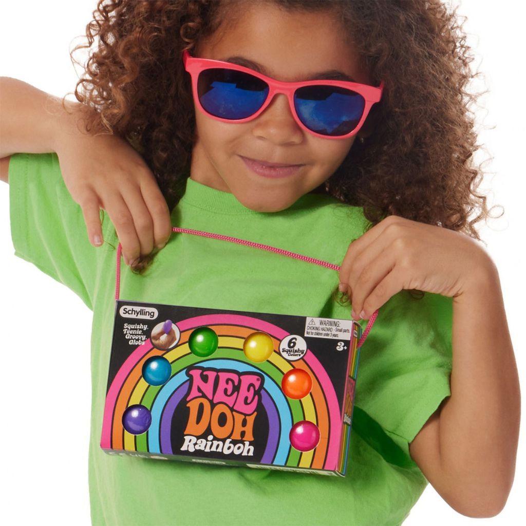 Kind Holding Rainbow Teenie Nee-Doh