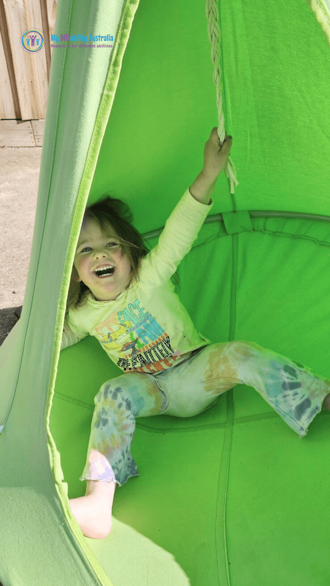 Kid Looking Happy Inside the Pod Swing