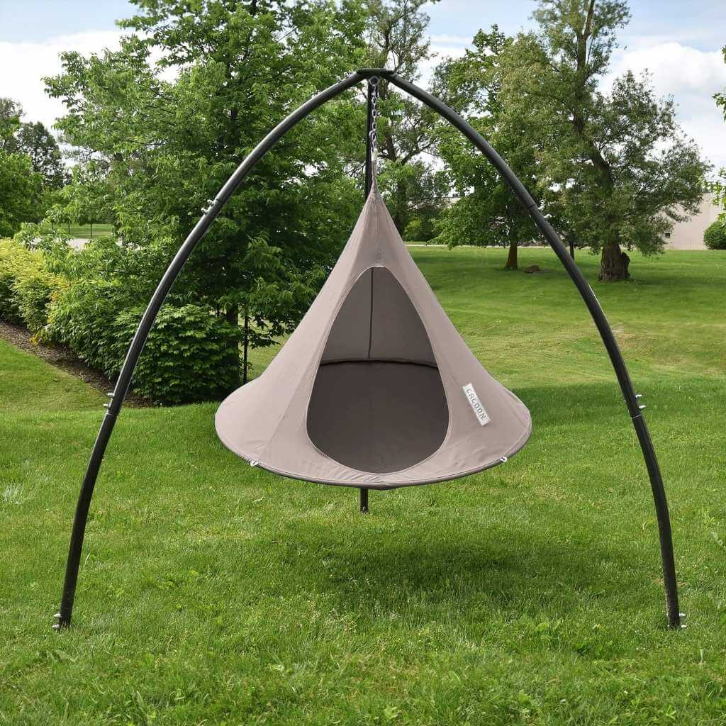 Lifestyle Image of Single Cacoon Taupe Assembled in Tripod Hanging Chair stand