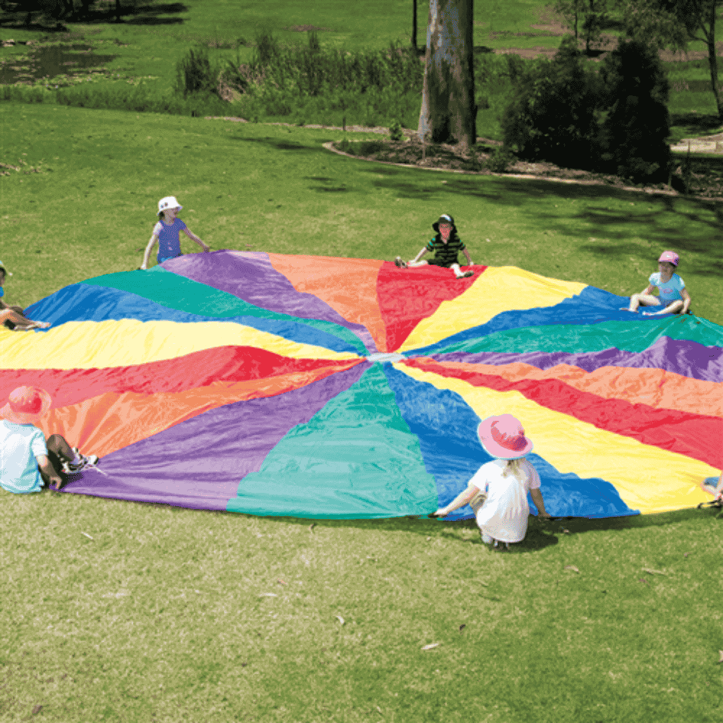 Parachute Play Kit Being Set Up In An Open Area Outdoors