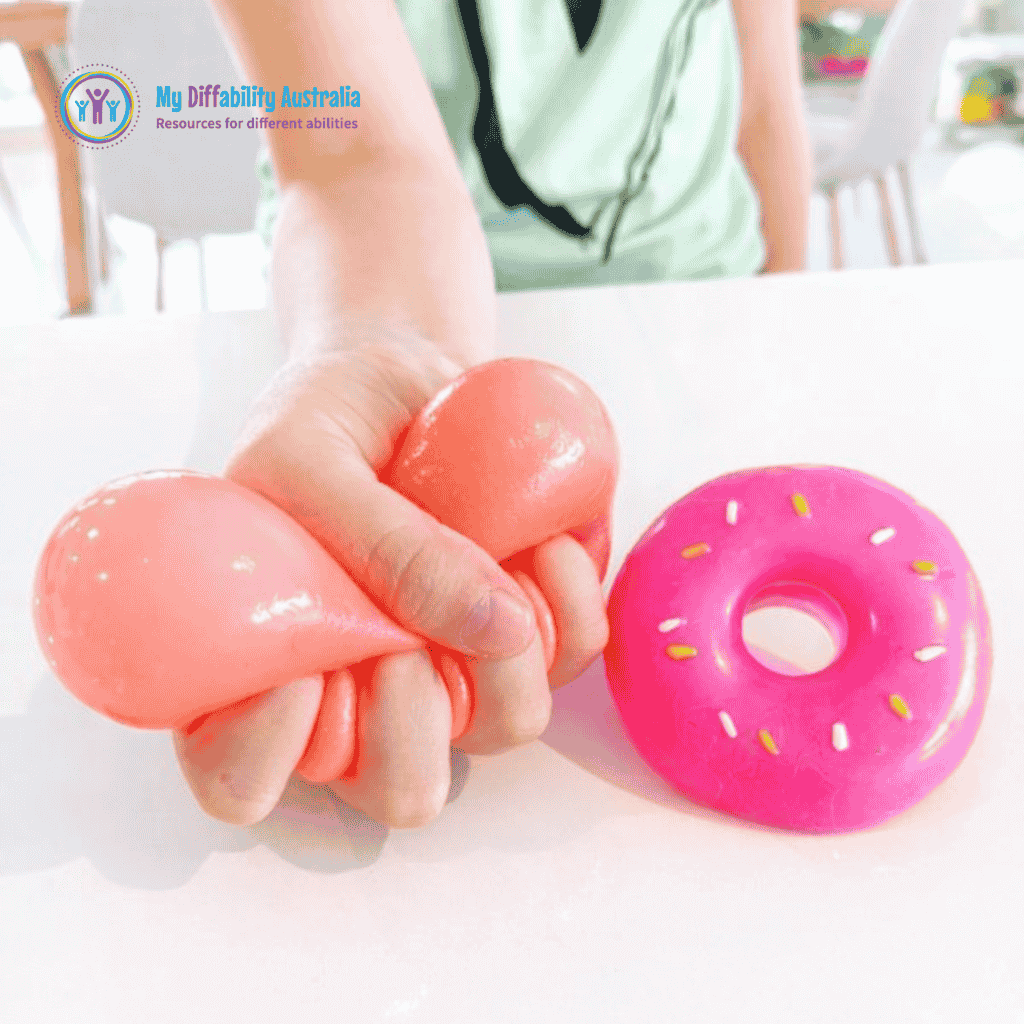 Photo Showing Two NeeDoh Dohnut One Being Squeezed and the other in the table