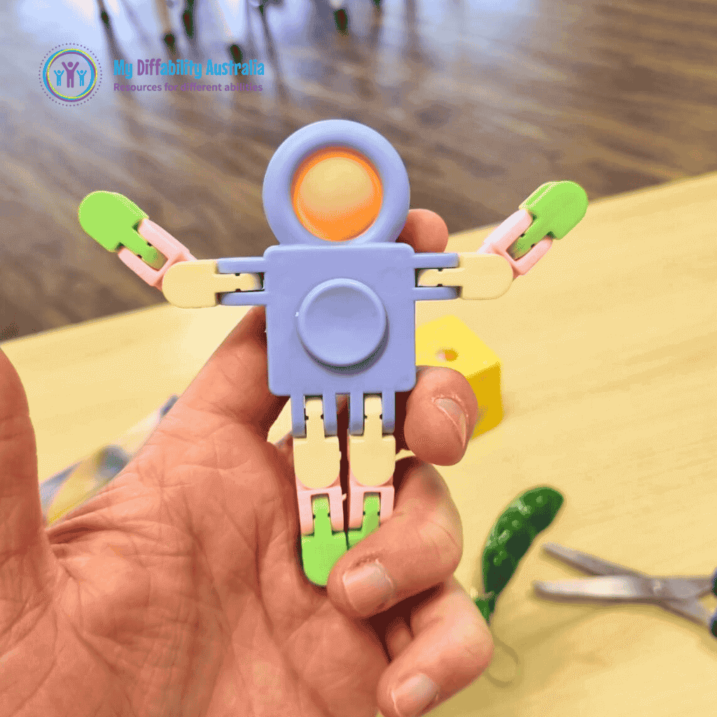 Picture Showing One Hand Holding Fidget Robot