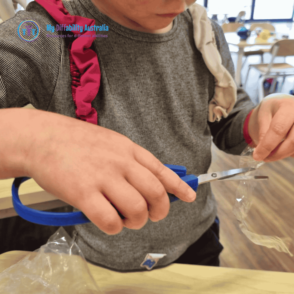 Picture Showing Young Girl Cutting Using Easy Grip Squeezy Scissors