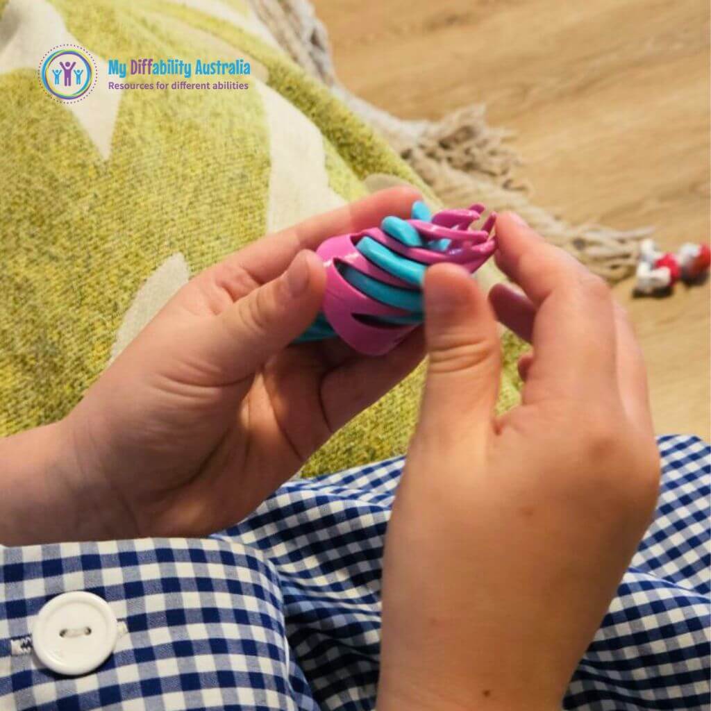 Picture of Hands Playing the Magic Swirl Tree Fidget Tool