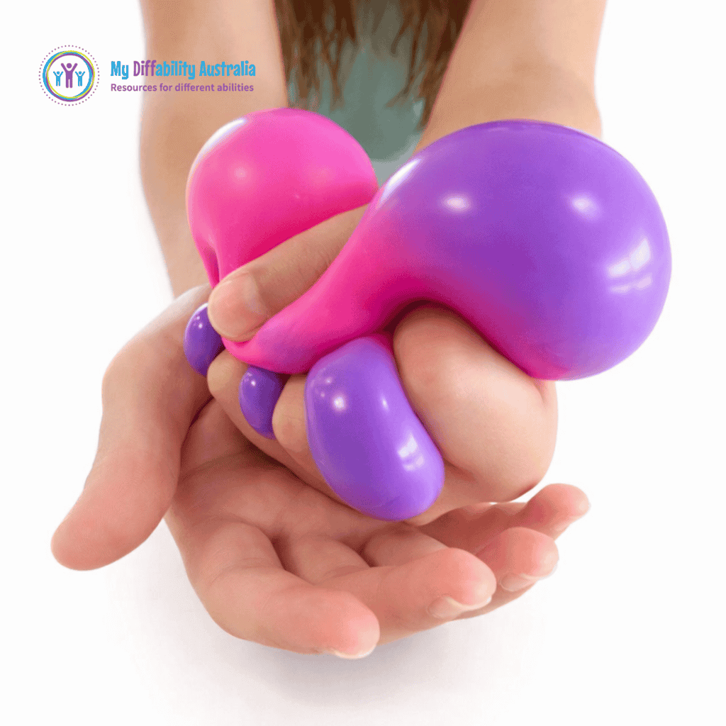 Picture of a hand squeezing Colour Changing Nee Doh