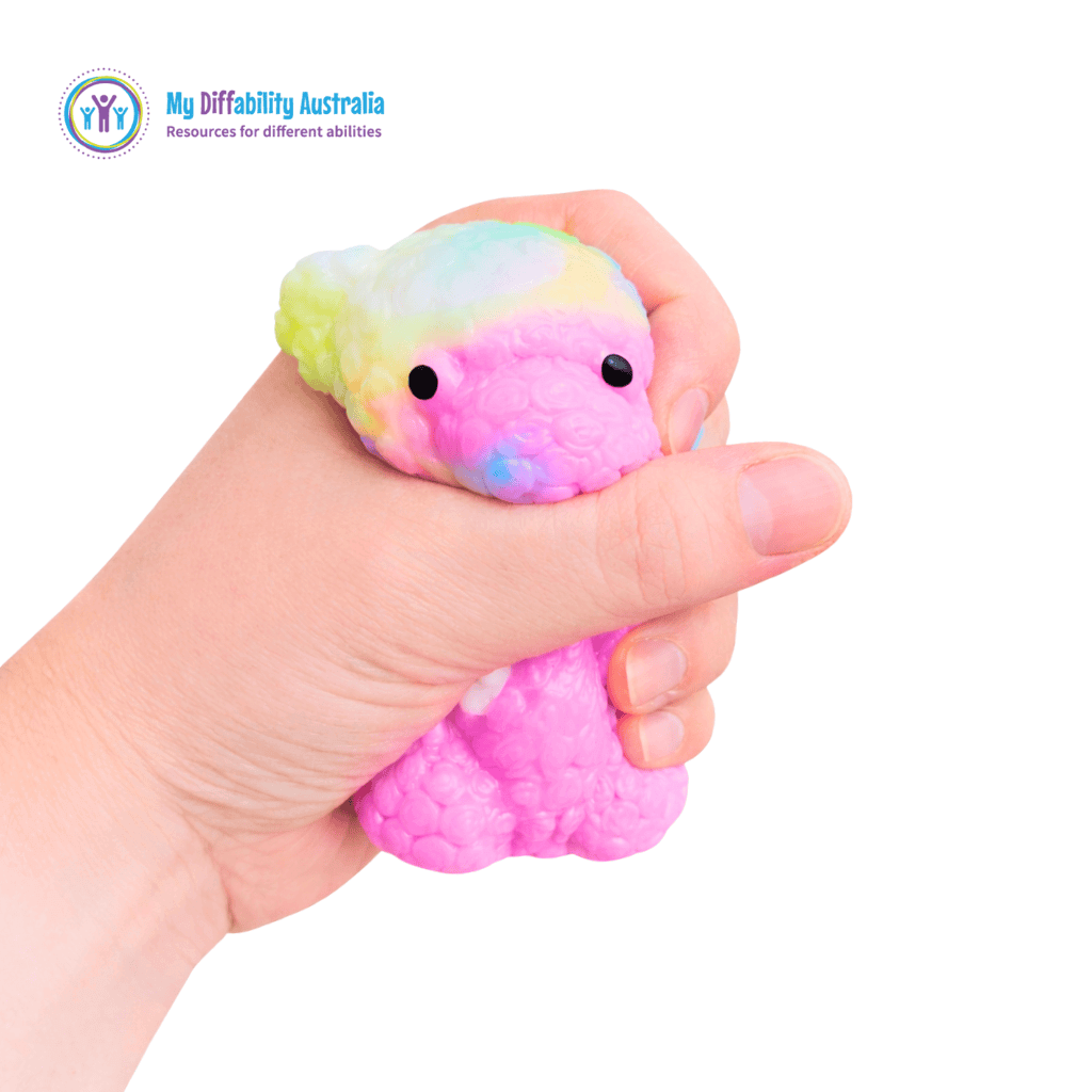 Picture of a hand squeezing Smooshmies Rainbow Sticky Bear