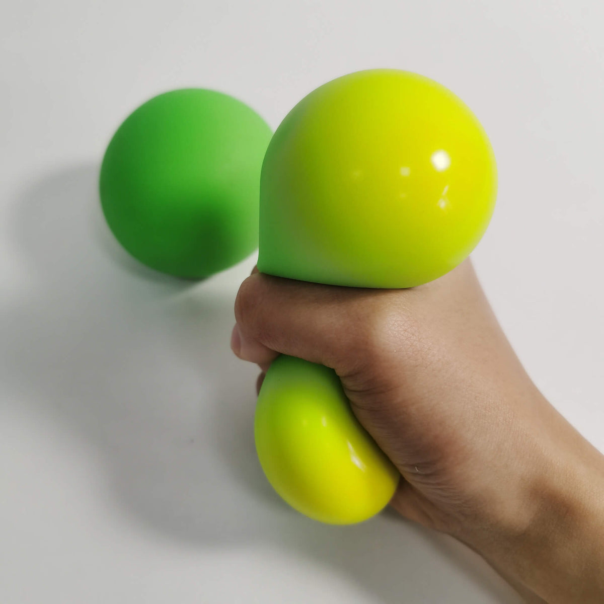 Squeezing Colour Change Squeeze Ball