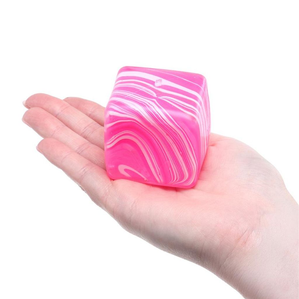 Squishy Squeeze Slow Rise Series Swirl Cube placed in a palm