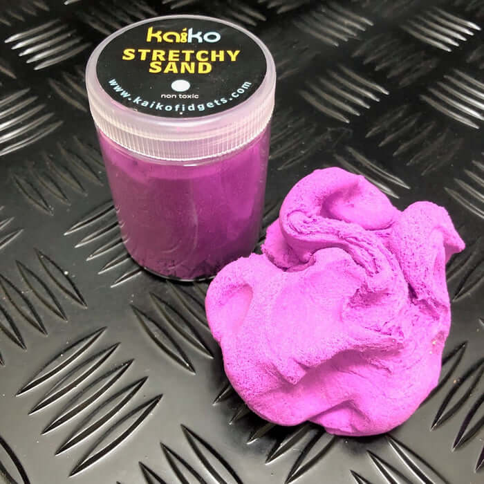 Stretchy Sand And Its Packaging In Purple