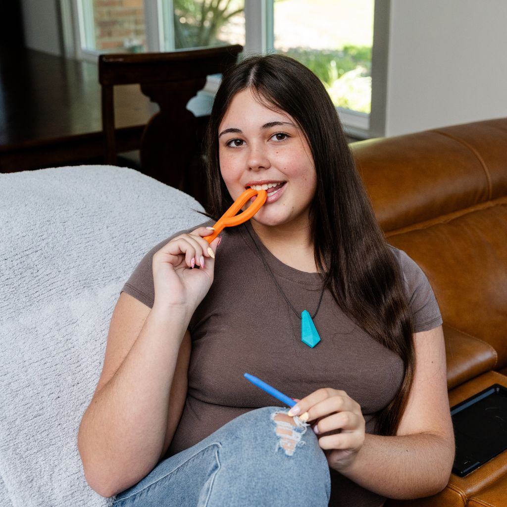 Teenage Girl biting ARK Grabber P Tube