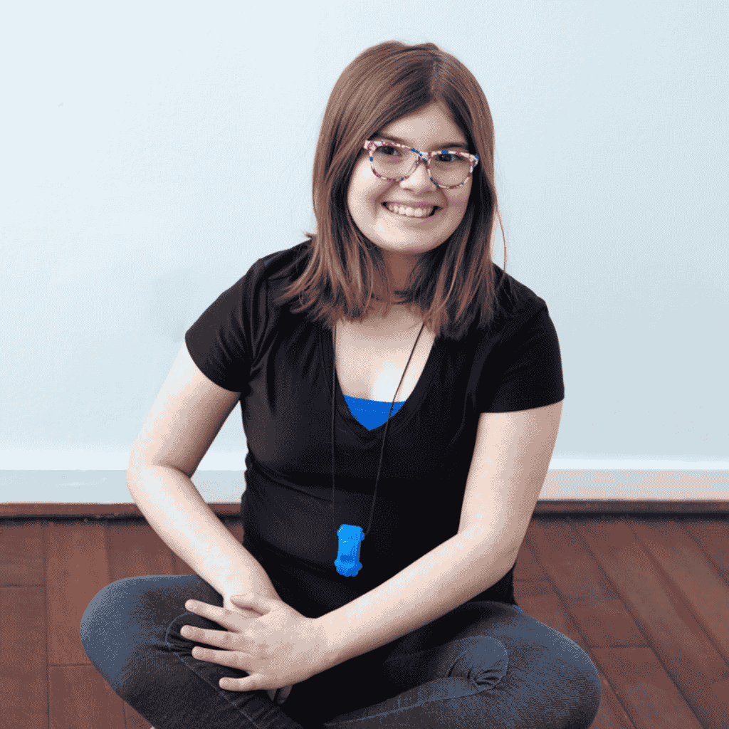 Teenage girl wearing ARK Racecar Necklace