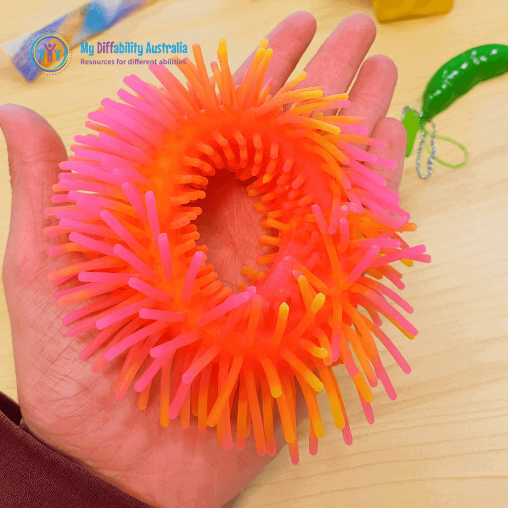 Two tone sensory wrist band placed in ones palm