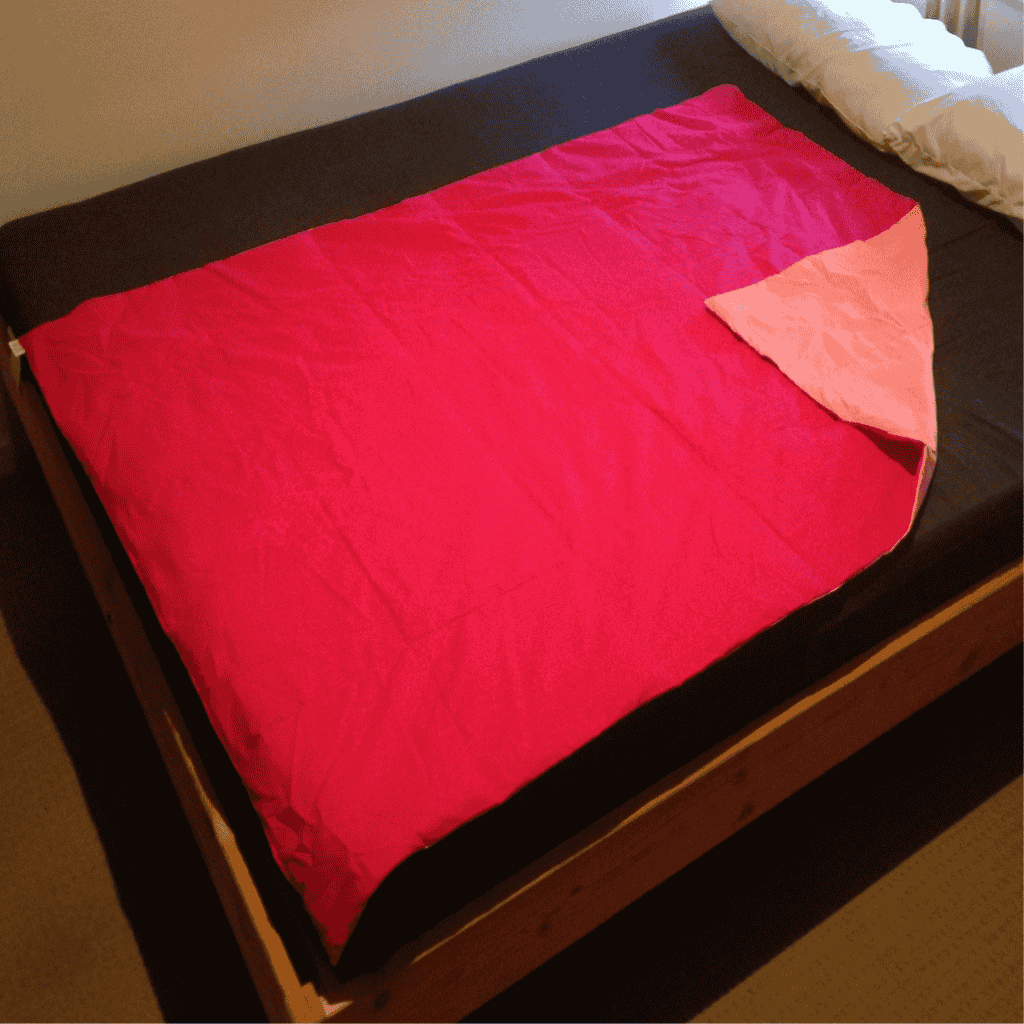 Weighted Blanket Single bed size pink on pink placed in the bed