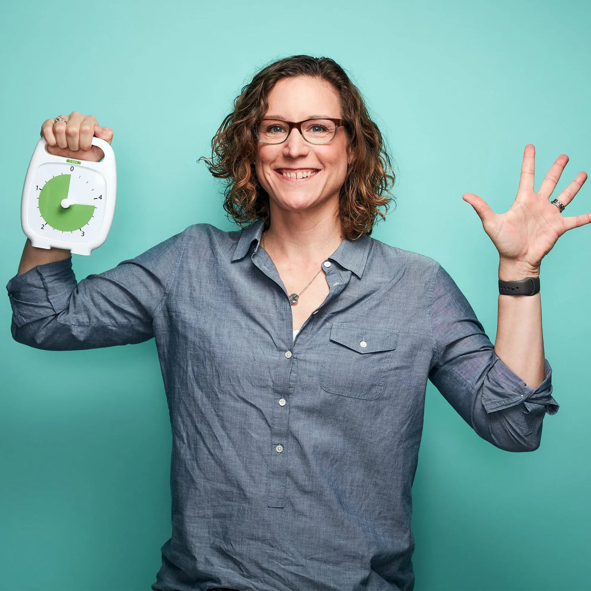 Woman Standing While Holding Time Timer Plus 5 Minute