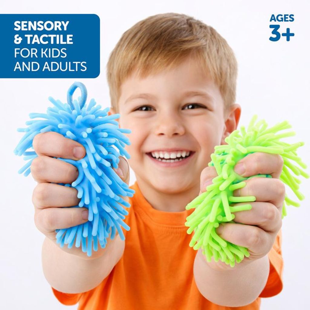 Young Boy Holding Squish Squeeze Stress Ball Fuzzy