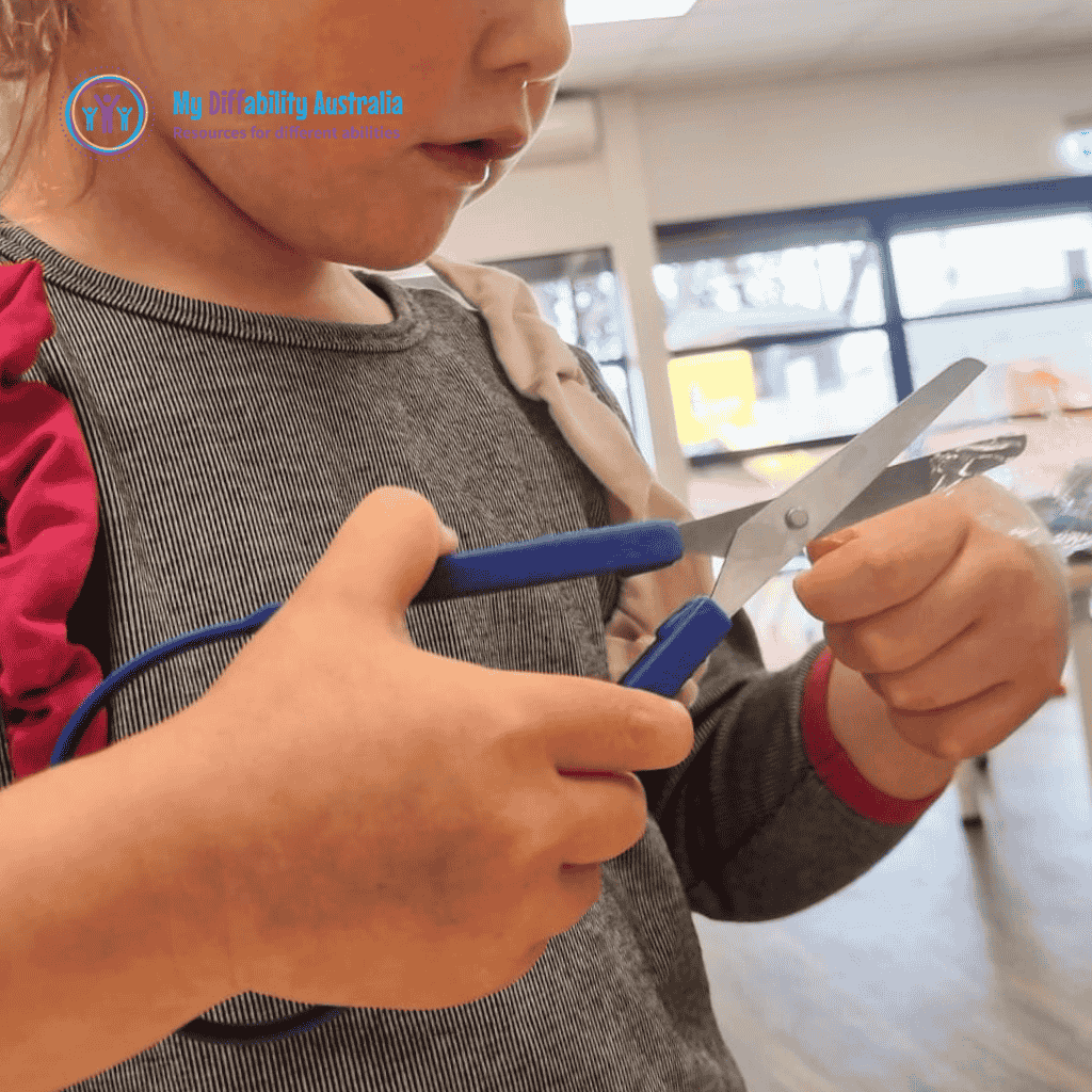 Young Girl Holding Easy Grip Squeezy Scissors