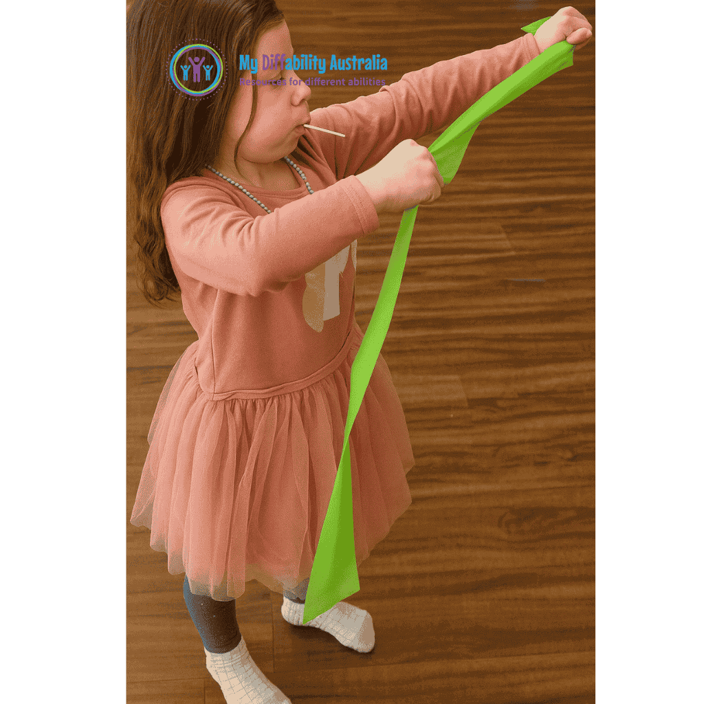 Young Girl Holding Green RepBand Latex Free Theraband