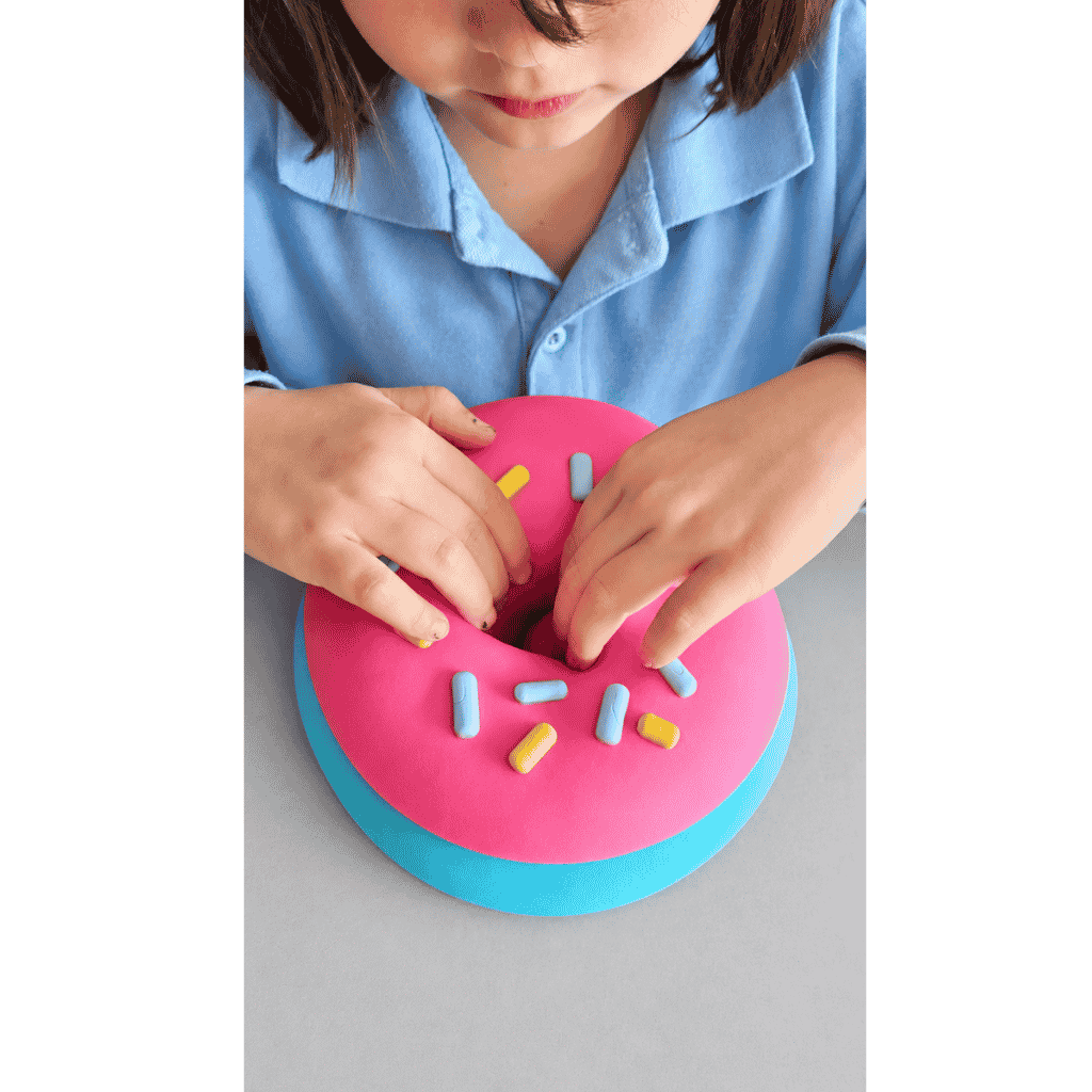 Young Girl Playing Giant Squeeze Donut