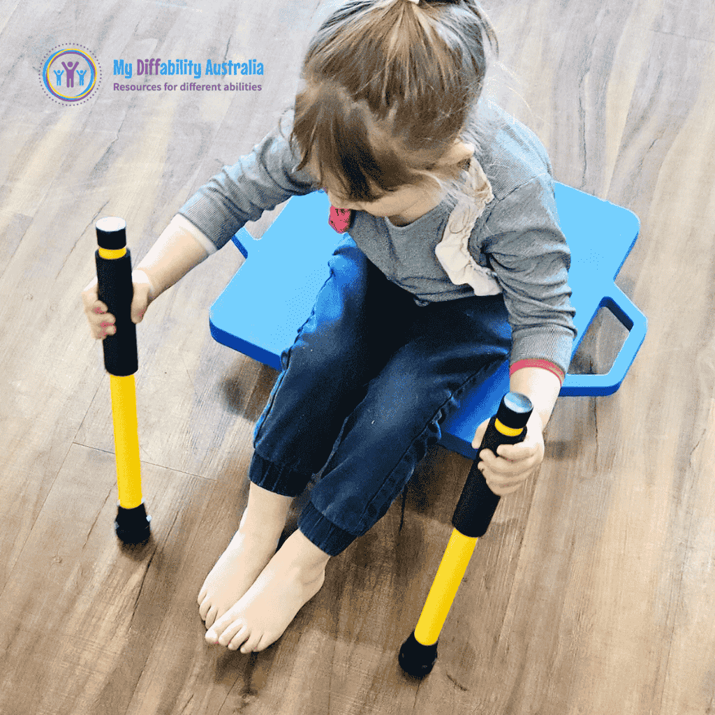 Young Girl Seating in the Scooter Board while holding 2 scooter paddles