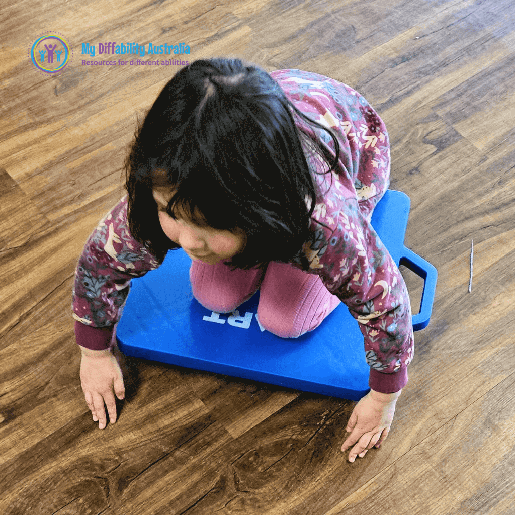 Young Girl Seating in the scooter board large blue