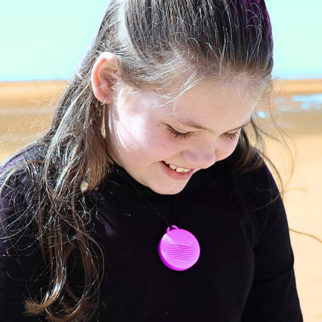 Young Girl Wearing Vibrant Hummingbird Pendant