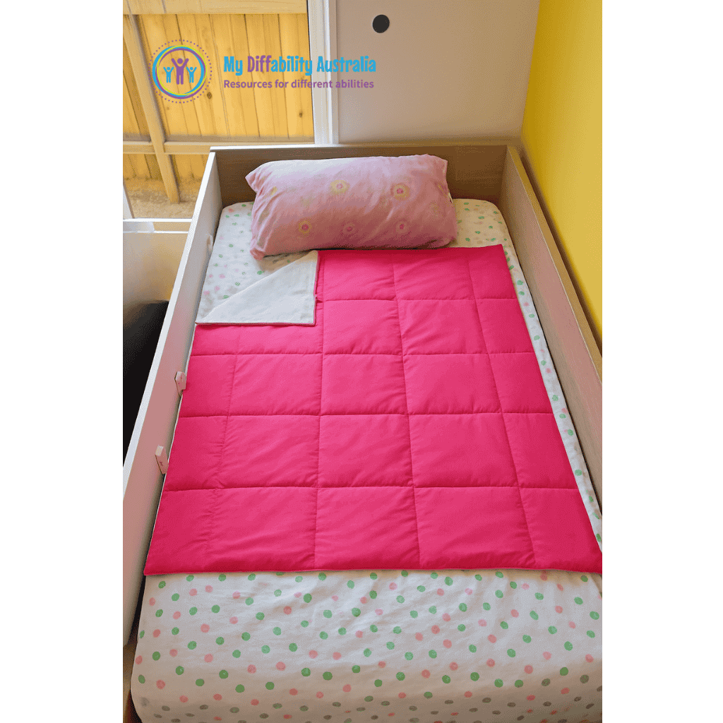 Zoom Out View of Kids Bed with Small Weighted Blanket Pink