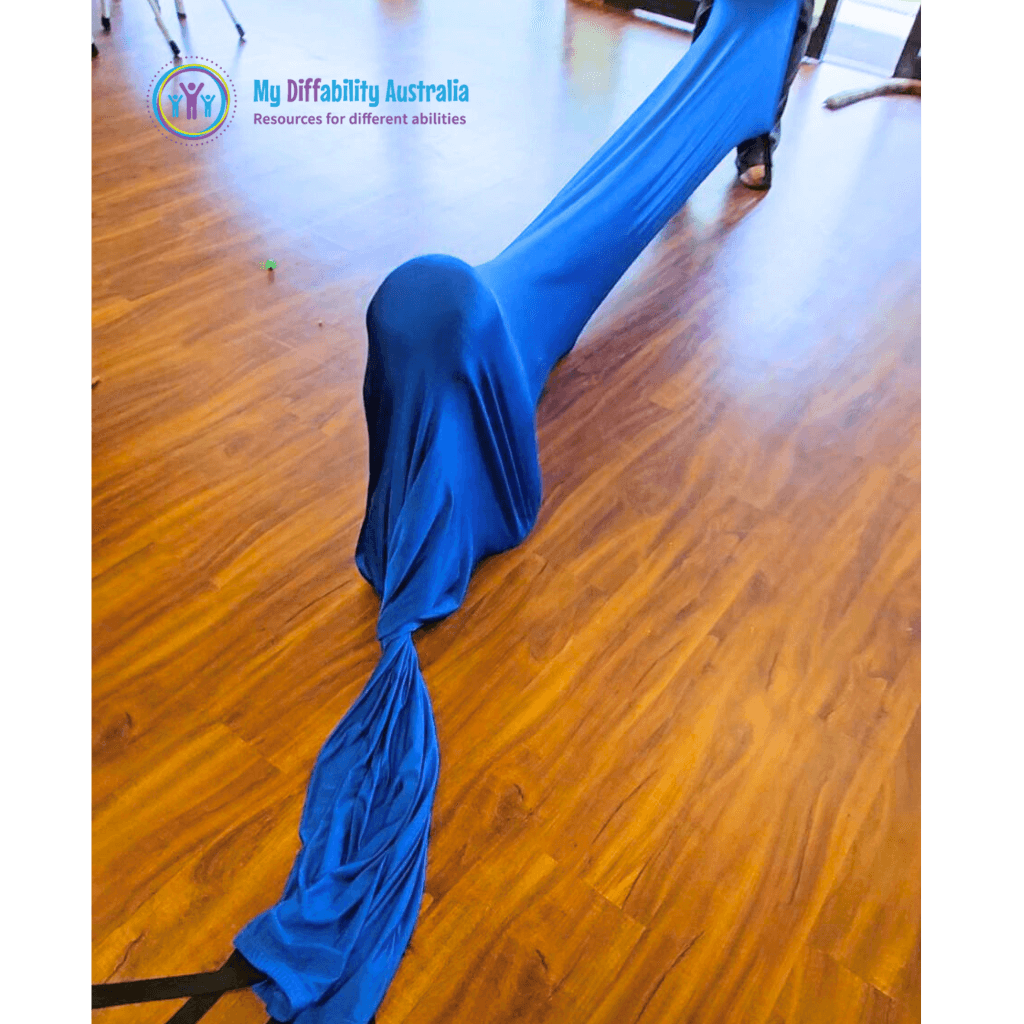 Child crawling through blue kids sensory play tunnel