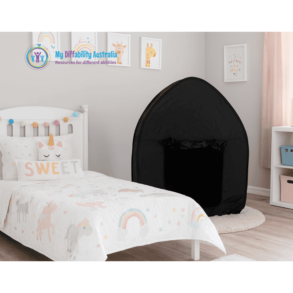 dark den sensory tent set up in a bedroom zoom out view